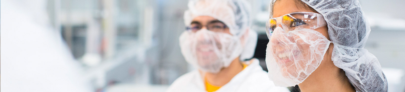 students wearing masks working in the research facility