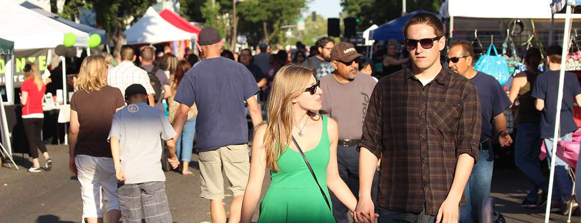 couple walking around event booths